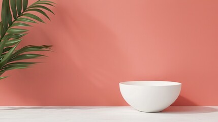 Wall Mural - A minimalistic scene featuring a white bowl on a surface next to a green leaf against a coral wall background.