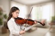 © BillionPhotos.com - Cute teen girl playing at music class
