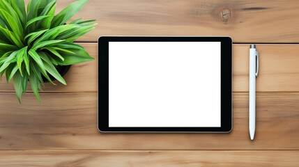 wooden desk with a black tablet on it. black tablet with white screen. The tablet is blank and is placed in the center of the desk