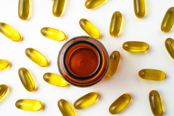 Wall Mural - Vitamin capsules in a bottle, soft gels, Fish oil capsules, omega 3, omega 9, vitamin D, vitamin E