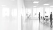 © ERiK - Abstract Blurred Office Interior with Employees and Modern Workstations