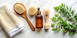 © Curie - Eco-Friendly Bath Products Flat Lay: Wooden Brush, Towel, Serum, White Background