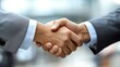 © aukkasit - Business negotiation handshake corporate office image professional setting close-up trust building