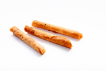 Crispy egg rolls, a popular Indonesian snack, perfect for Hari Raya celebrations. These sweet treats, known as 