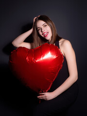 Wall Mural - Valentines day, love heart. Portrait of lovely valentine girl hold red heart. Beautiful woman celebrate valentine. Woman in love. Woman on Valentines Day. Symbol of love. Valentine card.