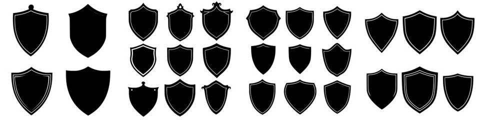 Wall Mural - collection of various shield shapes and designs displayed in a grid format on a plain background