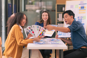Wall Mural - ux/ui design team discuss and brainstorm layouts for websites and mobile app prototypes in website a