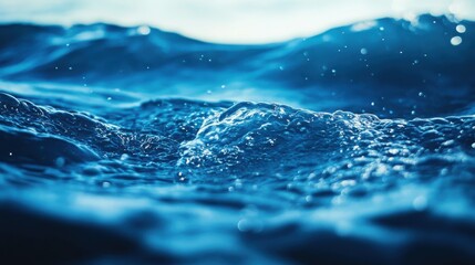 Aufkleber - Bokeh effect highlighting shades of aqua and indigo in tranquil water waves at sunrise
