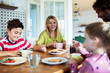 © Marko Geber - Happy family having breakfast together at home