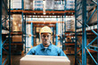 © Davor - Portrait of a male warehouse worker carrying package in storage facility