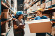 © Davor - Female supervisor checking inventory with worker in large warehouse