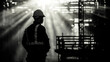© thien - Worker observing construction site with sunlight rays