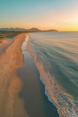 Wall Mural - Stunning Aerial View of a Serene Beach at Sunset with Golden Sands and Gentle Waves