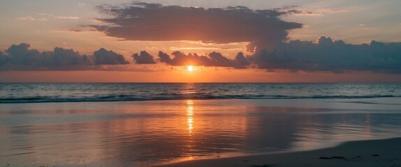 Wall Mural - Serene Sunset Over Ocean With Reflections On Wet Sand And Dramatic Clouds Creating A Tranquil Scene Perfect For Text Overlay