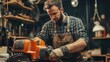 © yoga - A focused craftsman operating a chainsaw in a workshop.