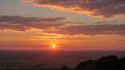 Wall Mural - Breathtaking sunset over rolling hills with vibrant hues of gold, orange, and pink as nightfall approaches in serene natural landscape.