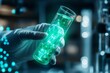 © Sanchai - A hand holding a test tube containing a glowing green liquid in a sterile laboratory