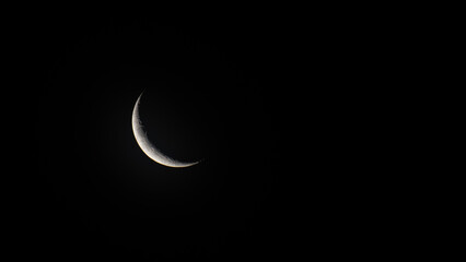 Wall Mural - crescent moon isolated in a black background.