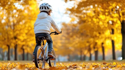 Wall Mural - Child cycling autumn park, leaves background, fall leisure