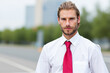 © Minerva Studio - Portrait of confident businessman posing outdoors in urban environment