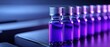 © VANATSANUN - Close-up of glass vials filled with purple liquid, showcasing modern pharmaceutical technology and laboratory precision.
