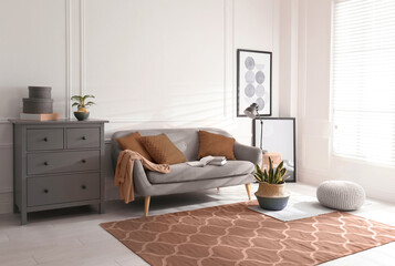 Poster - Cozy living room interior. Decorative elements in mocha mousse shade. Trendy color of 2025 year