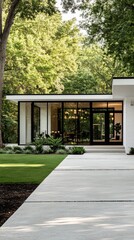 Wall Mural - Beautiful white garage complemented by a sleek black glass door showcasing the charm of a mid-century modern home in a scenic beach area