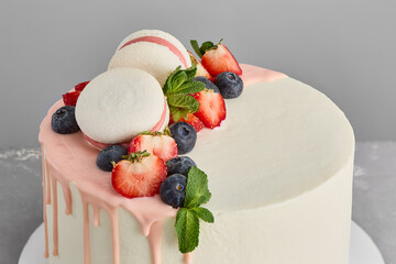 Wall Mural - Elegant Minimalist Cake with Fresh Berries and Macarons