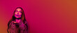 © New Africa - Beautiful young woman blowing kiss in neon light, space for text. Banner design