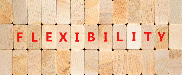 Wall Mural - Flexibility symbol. Concept word Flexibility on beautiful wooden blocks. Beautiful wooden blocks background. Business flexibility concept. Copy space.