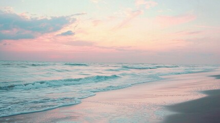 Wall Mural - A beautiful beach scene with a pink and orange sky