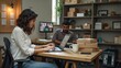 © natakot - A couple works together managing their small business logistics, using a laptop while packaging products in a creative workspace. The image reflects teamwork, entrepreneurship, and modern business