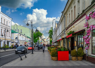 Wall Mural - pyatnitskaya street with tables of cafe in center of moscow, russia. cozy cityscape in moscow. archi