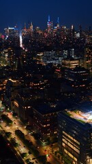 Wall Mural - Never sleeping New York at night. Breathtaking cityscape with lively traffic and multiple lights on. Top view.