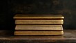 © pinporn manosri - A collection of gold bars stacked neatly in a dark setting, with copy space for text.