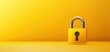 © CHONCHANOK PHOTO - A vibrant yellow padlock stands against a solid background, symbolizing security and protection in the digital age.