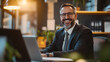 © Shahazadi - Smiling Businessman Working Laptop Office Happy Professional Success Job Desk Team Career Growth