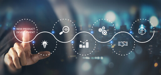 New product development and project roadmap concept. Business professional touching digital virtual screen with new product development roadmap icons, ideation, development and launching process.