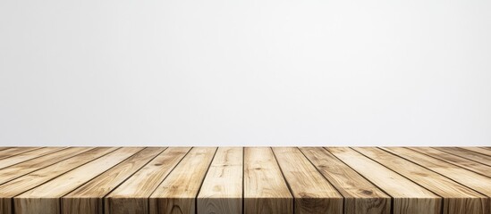 Poster - Serene kitchen setting featuring a rustic empty wooden table with warm tones against a soft blurred white wall background.