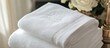 © meristock - Elegant white cotton guest towels with delicate embroidery and personalized monogram stacked neatly, showcasing refined luxury and comfort.