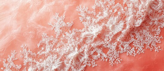 Poster - Intricate white lace on vibrant coral fabric background showcasing organic textile design with a clean grunge texture ideal for diverse applications
