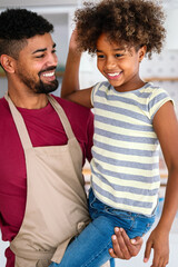 Wall Mural - Happy african american single dad spends happy moments with his daughter. Family love concept