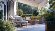 © Moritz - Elegant outdoor patio with striped awning, cozy wicker furniture, wooden accents, greenery, and shaded relaxation area
