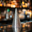 © Sekai - Silver Sequin Party Hat on a Glitzy Nightclub Bar for a Fun and Sparkling Celebration