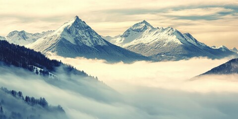 Wall Mural - Majestic snow-capped mountains rise above a blanket of soft fog in a serene vintage landscape with pastel tones creating tranquil beauty.