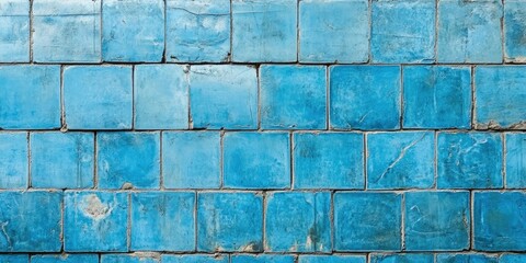 Aufkleber - Textured blue tiles in a grid pattern, showcasing varying shades of turquoise and azure, with some weathered edges, creating a rustic yet vibrant appearance.
