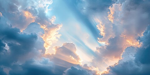 Poster - Dramatic cloudscape featuring soft blue tones and golden rays illuminating from behind clouds, creating a serene and tranquil atmosphere.