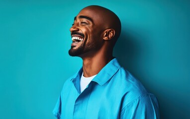 Wall Mural - A man with a shaved head is smiling and laughing