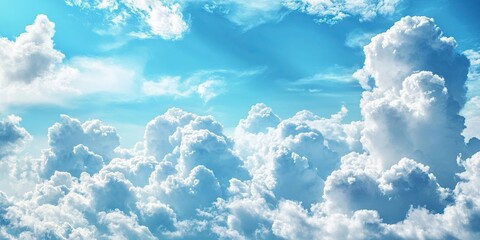 Poster - Fluffy white clouds scattered against a bright blue sky creating a serene atmosphere with soft light and depth in the background.