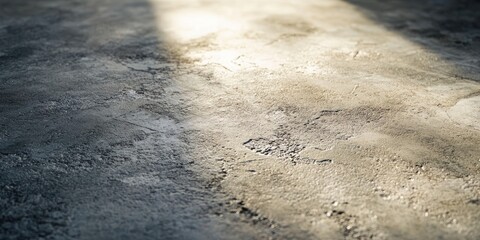 Wall Mural - Textured concrete surface illuminated by soft light creating subtle shadows and highlights in shades of gray and beige, positioned in the center.